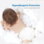 The photo shows a baby wearing an Aiwibi diaper pants, crawling on soft cotton.