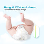 Baby wearing a diaper with a wetness indicator on a light blue background